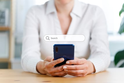 Person using a search engine on a mobile device