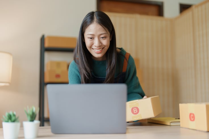 Happy Customer Looking at A Laptop