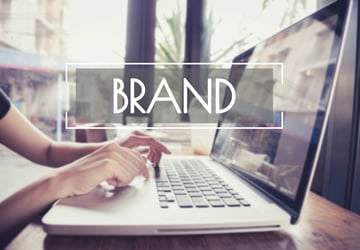Laptop User with the Word Brand across the photo
